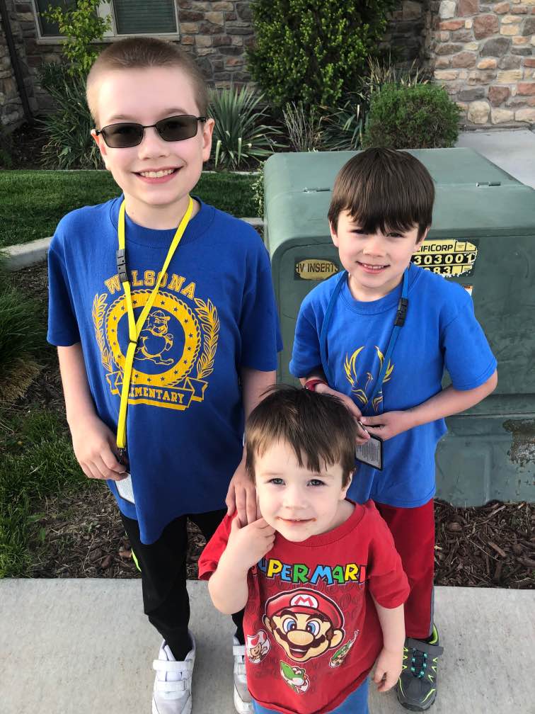 My three sons, Paul, Martin, and Garrett, waiting for our bus.