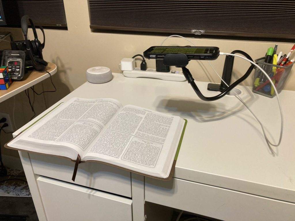 Side view of my magnifier over a copy of a Wesley Study Bible